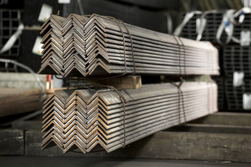 Stainless steel bars and pipes deposited in stacks