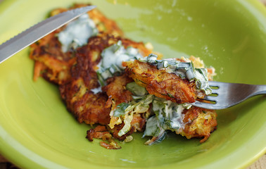 Vegetable zucchini and carrot pancakes closeup