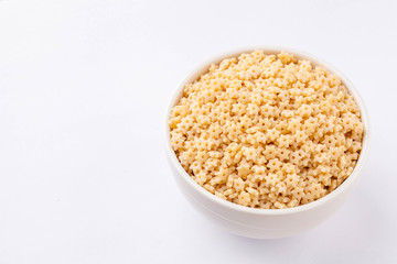 raw pasta in a white bowl