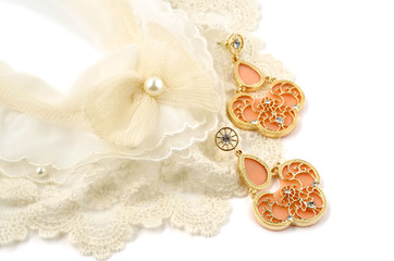 Vintage cream colored lace collar and earrings on white background
