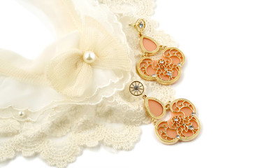 Vintage cream colored lace collar and earrings on white background