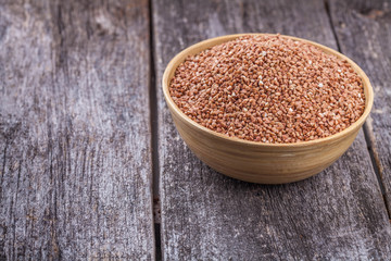 Buckwheat with a wooden spoon
