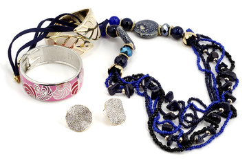 Dark blue necklace and bracelets on white background