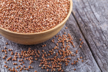 Buckwheat with a wooden spoon