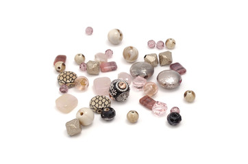 Decorative colorful beads scattered on white background - accessories for handmade and hobby