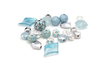 Decorative colorful beads scattered on white background - accessories for handmade and hobby