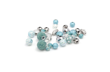 Decorative colorful beads scattered on white background - accessories for handmade and hobby