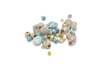 Decorative colorful beads scattered on white background - accessories for handmade and hobby