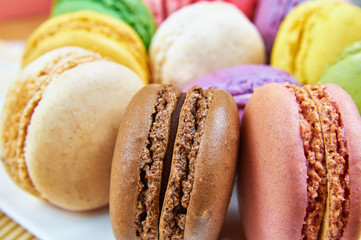 Set of colorful french macaroons on a plate