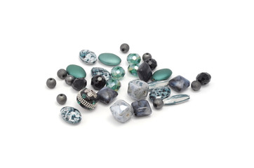 Decorative colorful beads scattered on white background - accessories for handmade and hobby