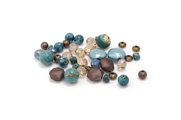Decorative colorful beads scattered on white background - accessories for handmade and hobby