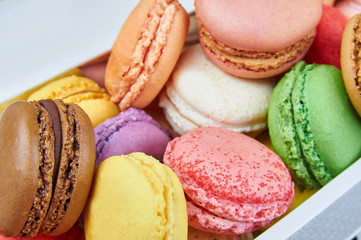 Colorful french macaroons in a box