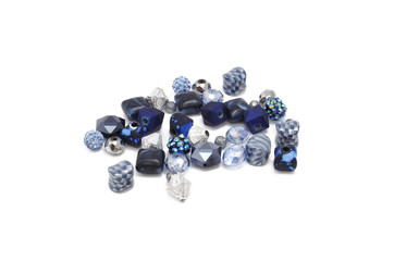 Decorative colorful beads scattered on white background - accessories for handmade and hobby