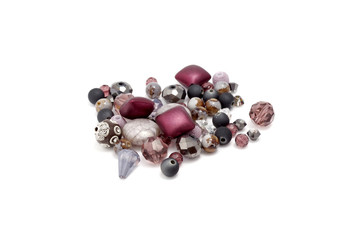 Decorative colorful beads scattered on white background - accessories for handmade and hobby