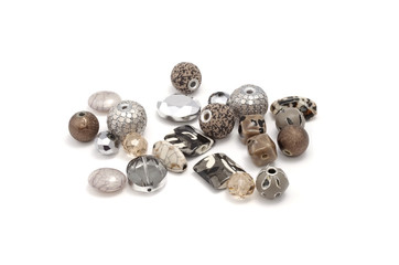 Decorative colorful beads scattered on white background - accessories for handmade and hobby