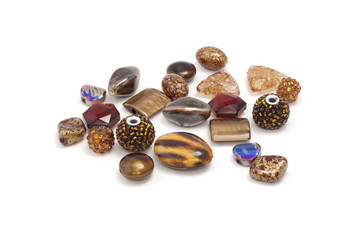 Decorative colorful beads scattered on white background - accessories for handmade and hobby