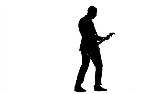 Musician pluck the strings electric guitar. Silhouette