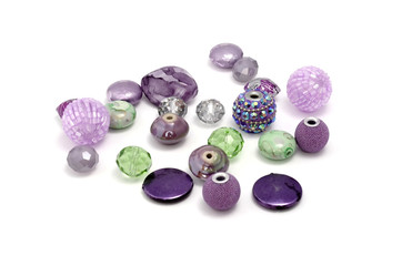 Decorative colorful beads scattered on white background - accessories for handmade and hobby
