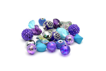 Decorative colorful beads scattered on white background - accessories for handmade and hobby