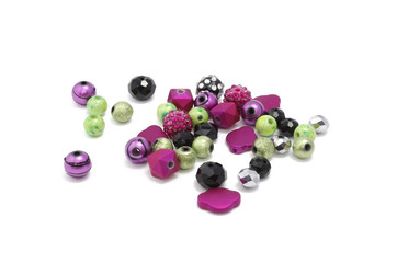 Decorative colorful beads scattered on white background - accessories for handmade and hobby