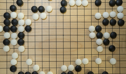 Chinese board game Go or Weiqi with copy space for title