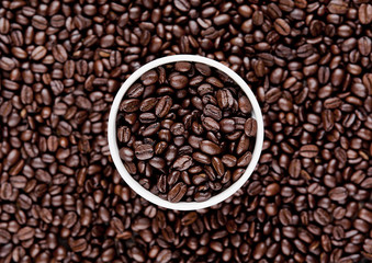 Hot coffee cup on beans for breakfast morning