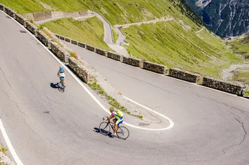 Papier Peint photo Vélo Man ride on bicycle from Famous Passo Dello Stelvio Climb. Italian - Swiss border, Alpen. Original sport wallpaper