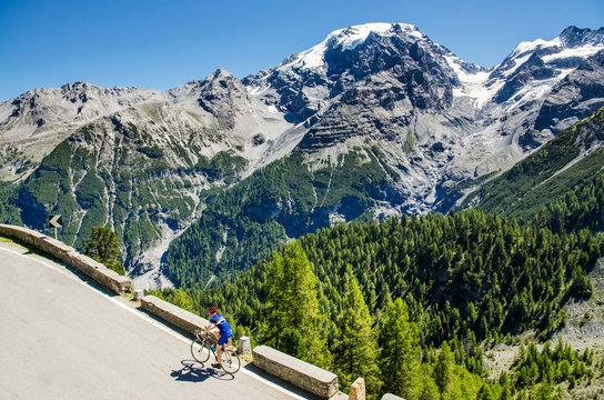 Famous Passo Dello Stelvio Road in Swiss - Italy border. Favourite place for all bike riders. Alone biker on the top.