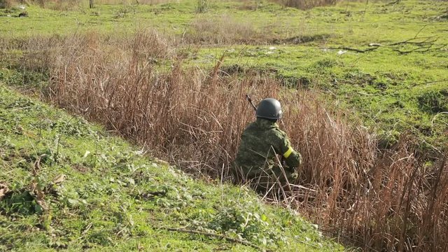 militias are fighting. Men in camouflage with guns and playing airsoft. war