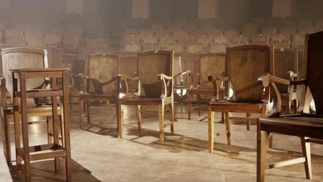 Pan on empty wooden chairs in orchestra room. Empty room without an orchestra. Few shots. Shot on RED EPIC Cinema Camera.