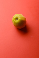 Apple isolated on red background