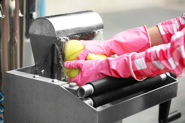 Car washing concept. Woman washing sponge, close up