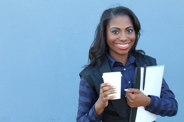 Portrait beautiful smiling young african woman with folder and to go coffee cup - Stock image