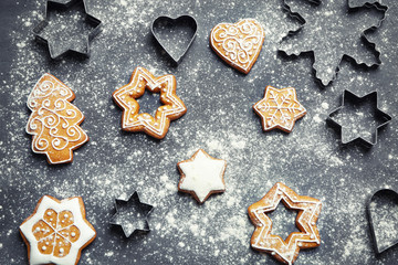 Delicious Christmas cookies with scattered powdered sugar on gray background