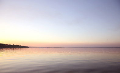 Calm river and beautiful sky at sunset