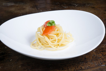 italian spaghetti with tomato and basil in a pot