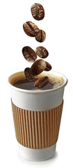 Roasted coffee beans falling into paper cup, white background