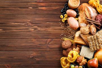 Set of different products on wooden background