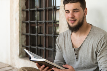 Arabic Muslim Man Reading Holy Islamic Book Koran