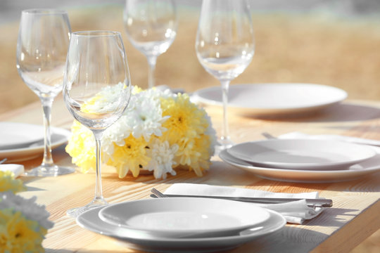 Table setting for buffet catering party outdoors, close up view