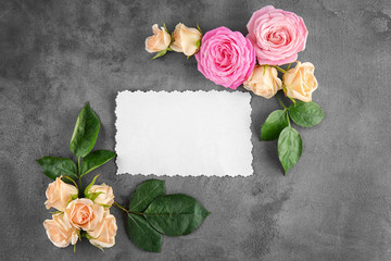 Floral frame with card on grey background