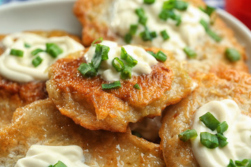 Plate with tasty potato pancakes for Hanukkah, closeup