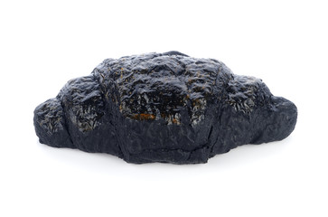 Charcoal croissant on white background
