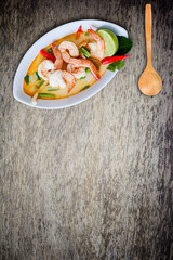 Tom yam kong or Tom yum, Tom yam is a spicy clear soup typical i