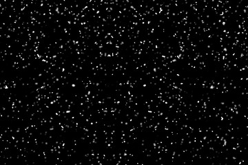snow flying over the black background, use as texture, pattern o