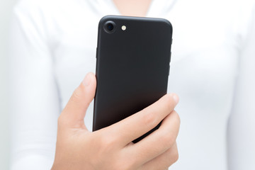 woman holding phone showing backside