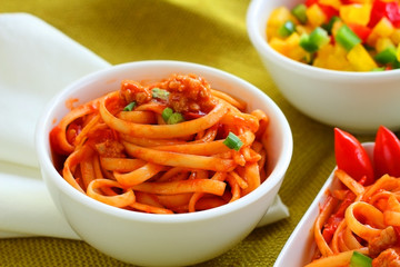 Pasta with pork and tomato sauce.