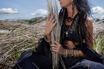 Beautiful young boho woman on grass. Close up