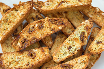 Classic Italian biscotti cookies on a white background. Festive Christmas cookies from Tuscany.