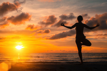 Fototapeta na wymiar Yoga practicing at sunset, serenity and meditation.